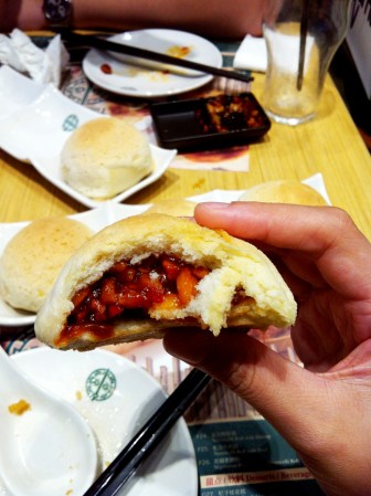 Baked bun with pork - close up of the pork