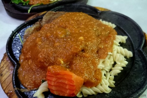 Beef steak with spaghetti gravy