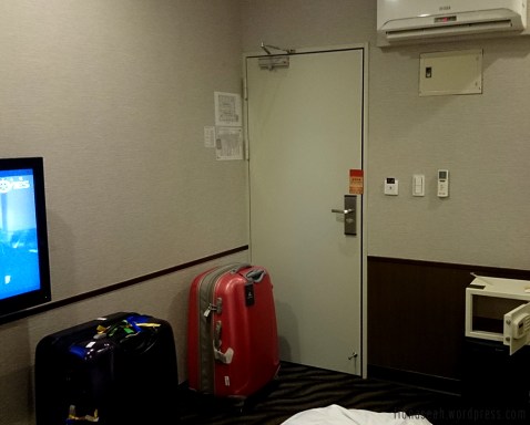 Near the exit of the room