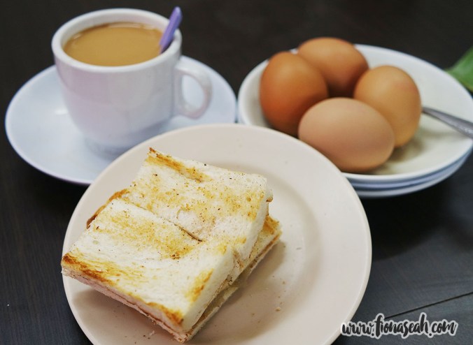 Kaya toast and soft-boiled eggs with a cup of Teh