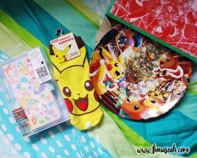 Universal handphone flip cover with slots for cards (left) and porcelain plate from Pokemon Center Mega Tokyo! Pikachu socks from one of the shops at Harajuku