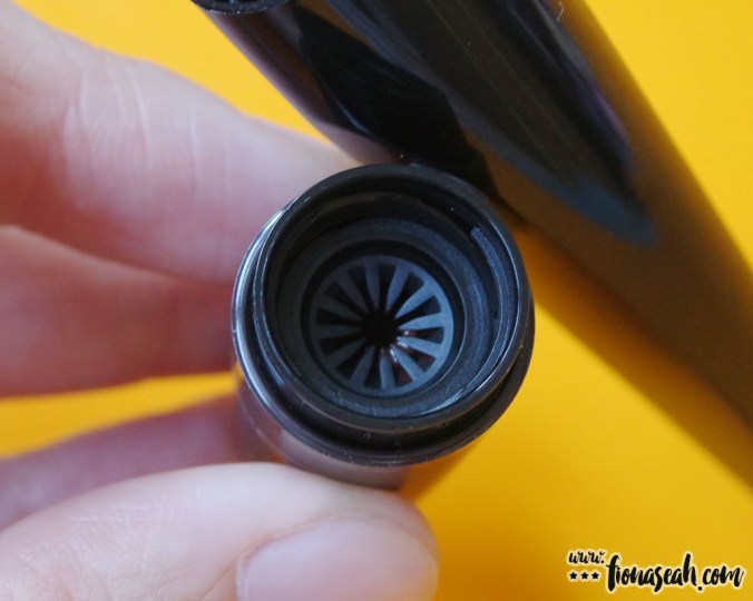 The stopper is shaped like a starburst so that the roller applicator can be inserted into the tube in any way