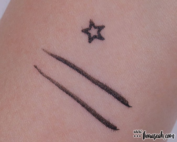 Stamp and eyeliner (two strokes to show continuity of ink flow) swatches. The first pass of the eyeliner is directly below the star. Notice how it bleeds more than the one next to it?