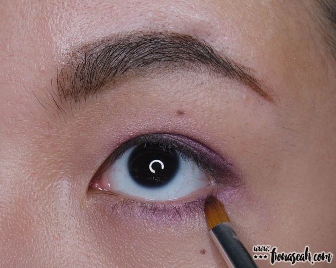 Using the same brush, add definition along the outer corner of the eye and do a little bit of crease-cutting on the upper lid. Blend out harsh edges with shader brush.