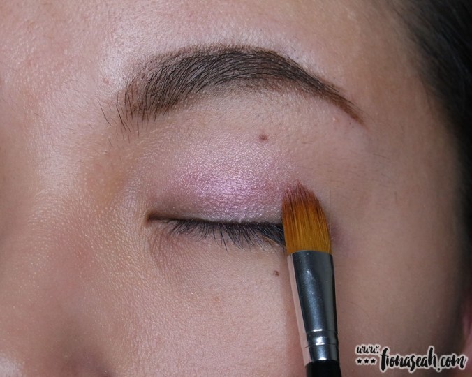 With the same end of the brush, apply the styling shade above the base