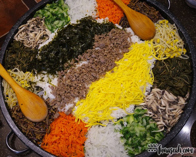 A gigantic stone bowl of bibimbap (minus the sunny side up) to be shared among a table of 8-10