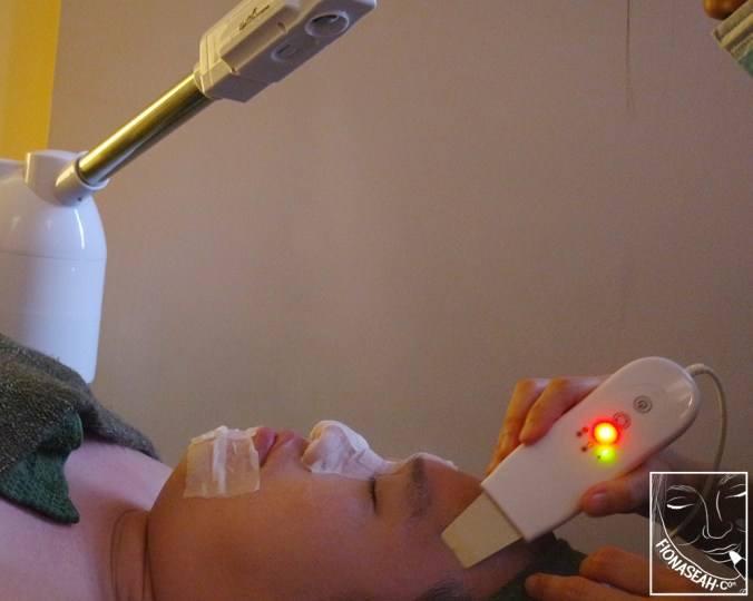 Ultrasonic cleaning while his face was being steamed (not sure if you can see clearly but there's steam coming down from that machine on top of him)