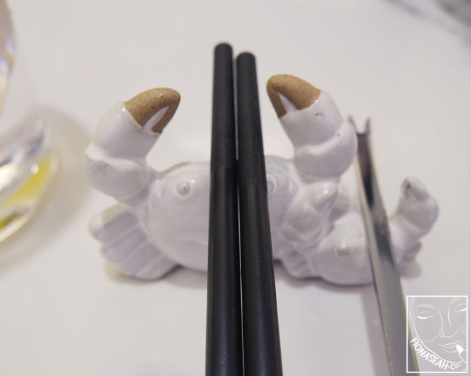 Adorable crab-shaped chopstick rest. Look, it even has a baby crab next to it to support your meat picker!